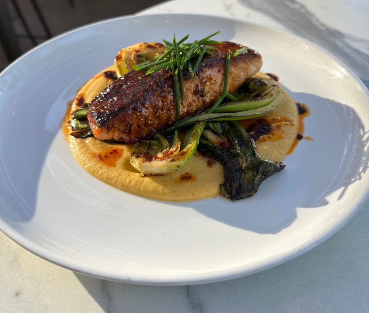 Calabrian chili glazed salmon (Ballast Brewing Co. at Downtown Disney District in Anaheim, Calif.): Six-ounce pan roasted salmon covered in a Calabrian chili glaze served over a carrot and parsnip purée and miso-marinated bok choy